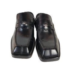 Pair of black leather shoes on a white background