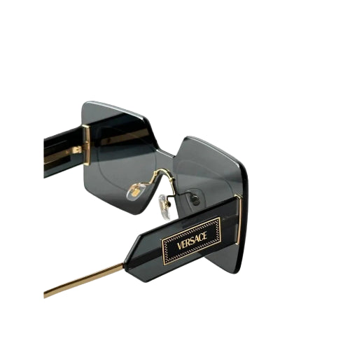 Versace sunglasses with a dark gray acetate frame and gold-tone metal temples, shown with their signature black Versace packaging box.