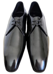 Black dress shoes on a plain background