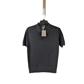 Dark gray polo shirt on a hanger with a tag against a light gray background