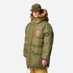 Person wearing a green winter coat with fur hood on a white background