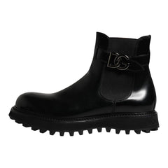Black rain boot with a brand logo on a white background