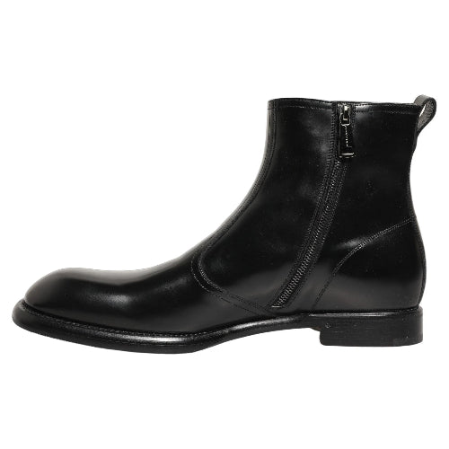 A black leather ankle boot with a side zipper, shown from a three-quarters angle on a plain white background.