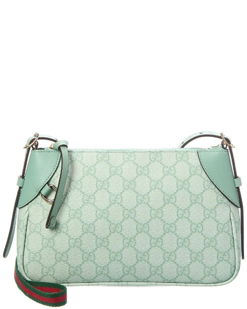 Light blue handbag with Gucci logo and green and red accents on a white background
