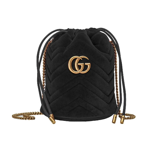 Black quilted handbag with gold chain and logo on a white background