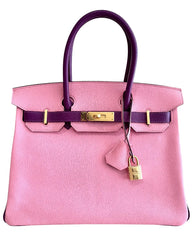 Pink handbag with gold hardware on a white background