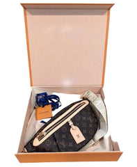 Louis Vuitton pouch with monogram pattern in an open box on a light background