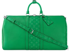 Green travel bag with monogram pattern on a white background