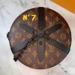 Round brown bag with black propeller design on a marble surface