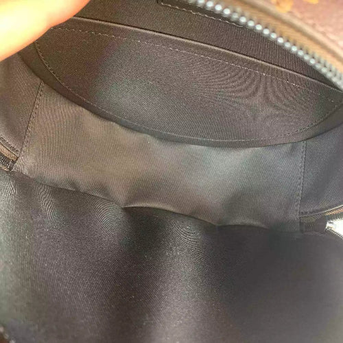 Close-up of a dark gray fabric surface with a zipper