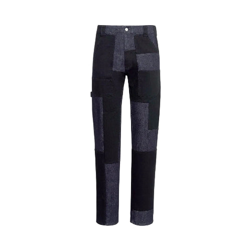 A pair of patchwork patchwork pants in dark denim and black fabric, shown against a plain white background.