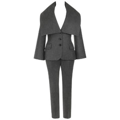 A dark gray two-piece suit with a wide lapel blazer jacket and matching trousers, shown against a plain white background.