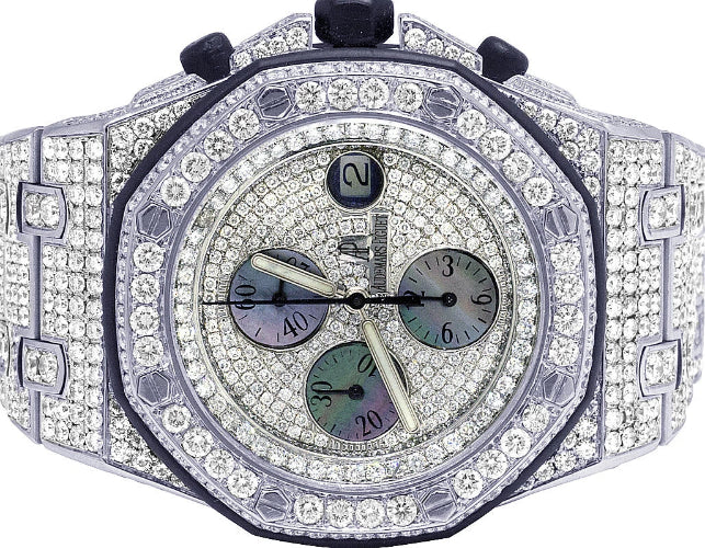 Luxury watch with diamond-studded case on a white background