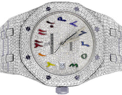 Luxury watch with diamond-studded case and colorful face elements on a white background