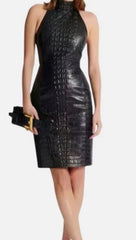 A black faux-leather sheath dress with a glossy finish, featuring a high neckline, a fitted silhouette, and a knee-length hem, shown on a model against a white background.