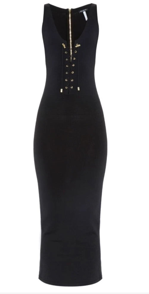 Black dress with gold zipper details on a white background