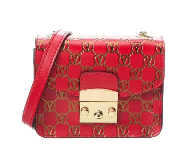 Red handbag with gold logo pattern on a white background