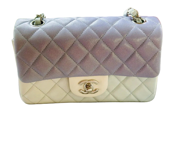 Chanel handbag with quilted design on a light background