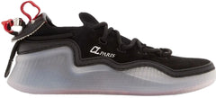 A black Nike Air Jordan 11 Retro Low sneaker with a translucent gray and white midsole and a red Jumpman logo on the heel.