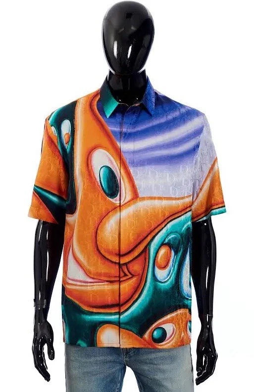 Mannequin wearing a colorful shirt with abstract design on a white background