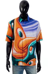 Mannequin wearing a colorful shirt with abstract design on a white background