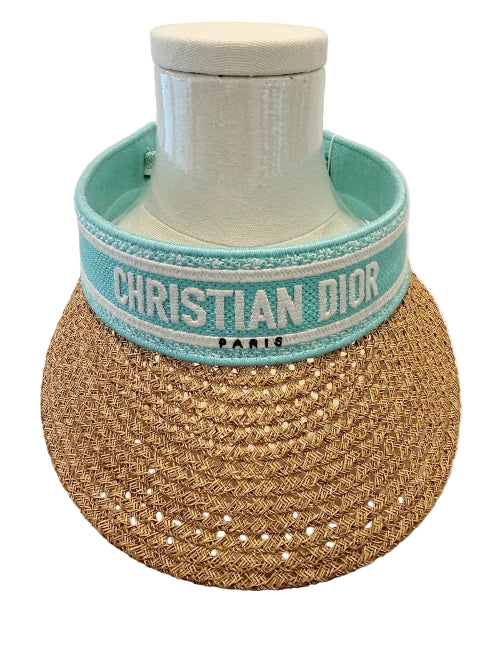 Woven coaster with 'Christian Dior' branding on a white background
