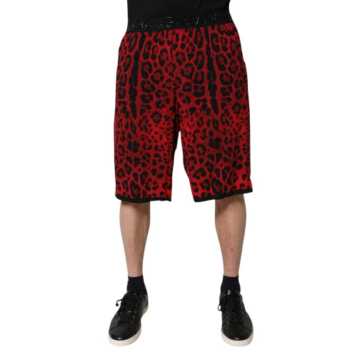Red leopard print shorts worn by a person on a white background