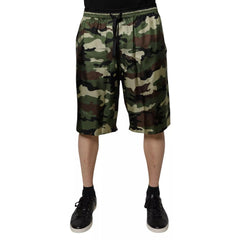Camouflage shorts worn by a person on a white background