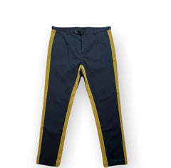 Navy pants with yellow accents on a white background