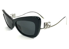 Black sunglasses with decorative metal frame on a white background