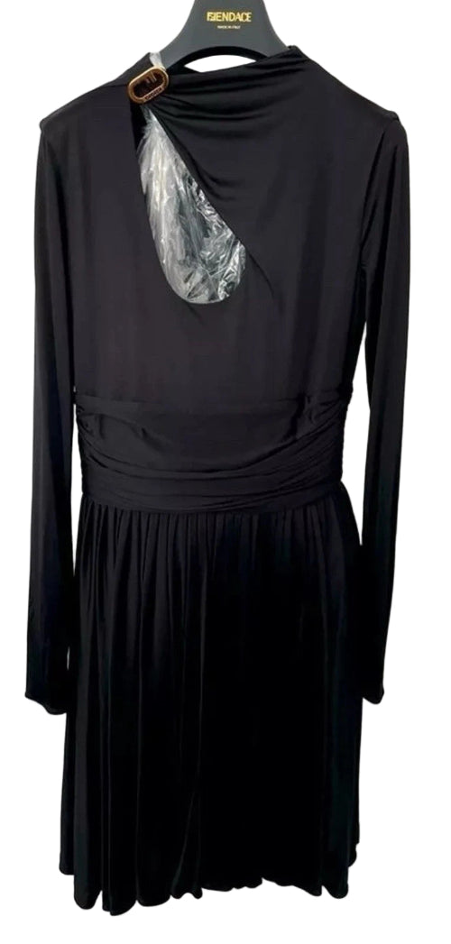 Black dress with a silver design on a hanger against a white background