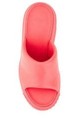 Coral-colored sandal on a white background