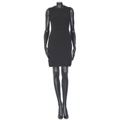 Black dress on a mannequin against a white background