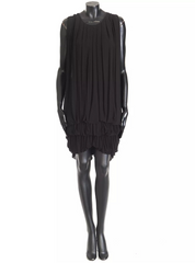 Black sleeveless dress on a mannequin against a white background