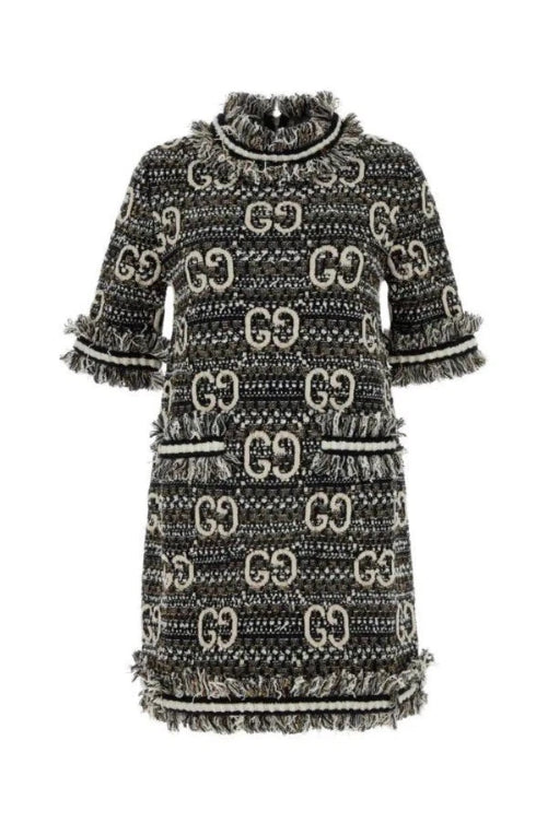 Black and white patterned dress with a collar on a plain background