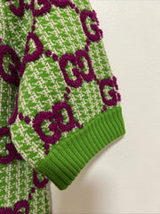 Green and white patterned garment with purple accents on a neutral background