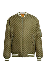 A bomber jacket featuring an all-over olive green and brown monogram pattern, with striped ribbed collar, cuffs, and hem, and zippered pockets.
