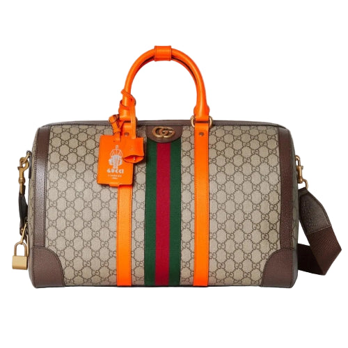 Designer handbag with orange handle and colorful stripes on a light gray background