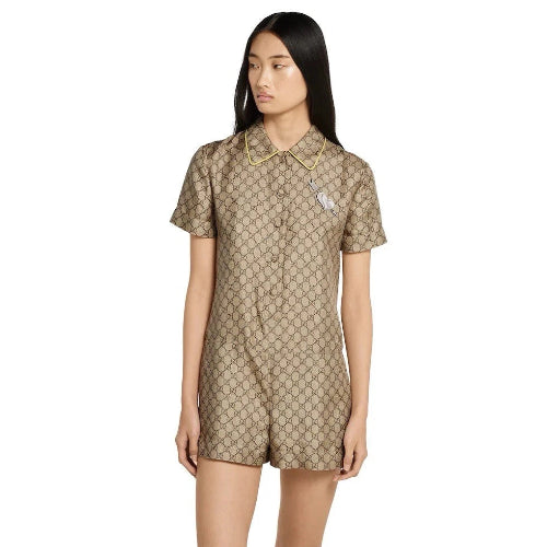 Woman wearing a patterned dress against a plain background
