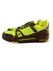 Vuitton sneaker with bright green and brown design on a box
