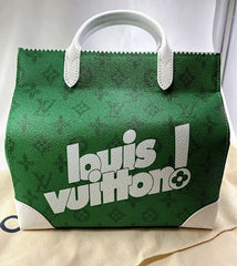 Green Louis Vuitton handbag with white handles on a light background