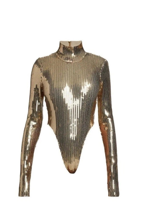 Metallic long-sleeve top on a mannequin against a white background