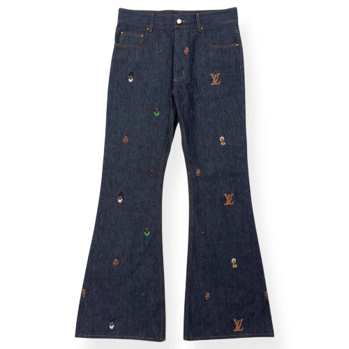 Dark blue jeans with embroidered logos on a white background