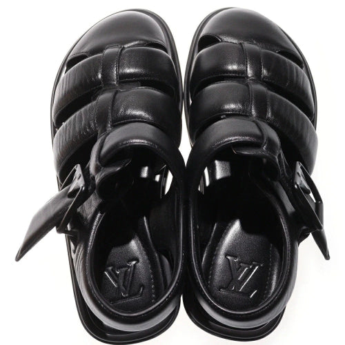 Pair of black sandals on a white background