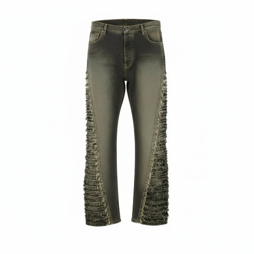 Green jeans with ruffled details on a white background