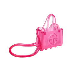 Pink transparent handbag with a logo on a light gray background