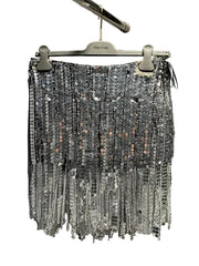 A silver tinsel fringe chandelier hanging from a black metal rod against a dark background.
