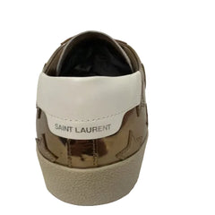 Saint Laurent sneaker with gold and white design on a white background
