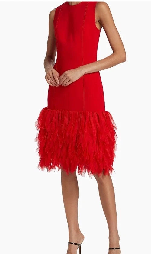 Red dress with feathered skirt on a white background