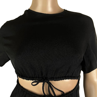 Black crop top with a tie detail on a mannequin against a white background